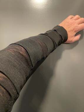 Unplugged Museum Black Multi-Strap Elastic Long Sleeve Top